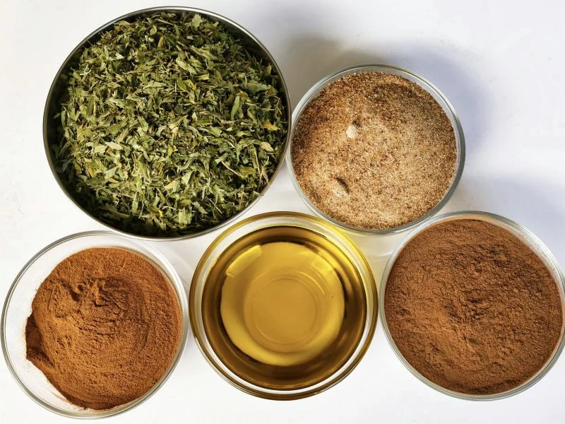 Bowls of dried herbs and ground spices